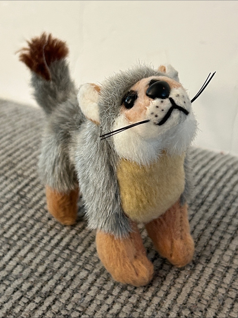 miniature plush Fox is a realistic-style grey fox or wolf pup collectible toy
